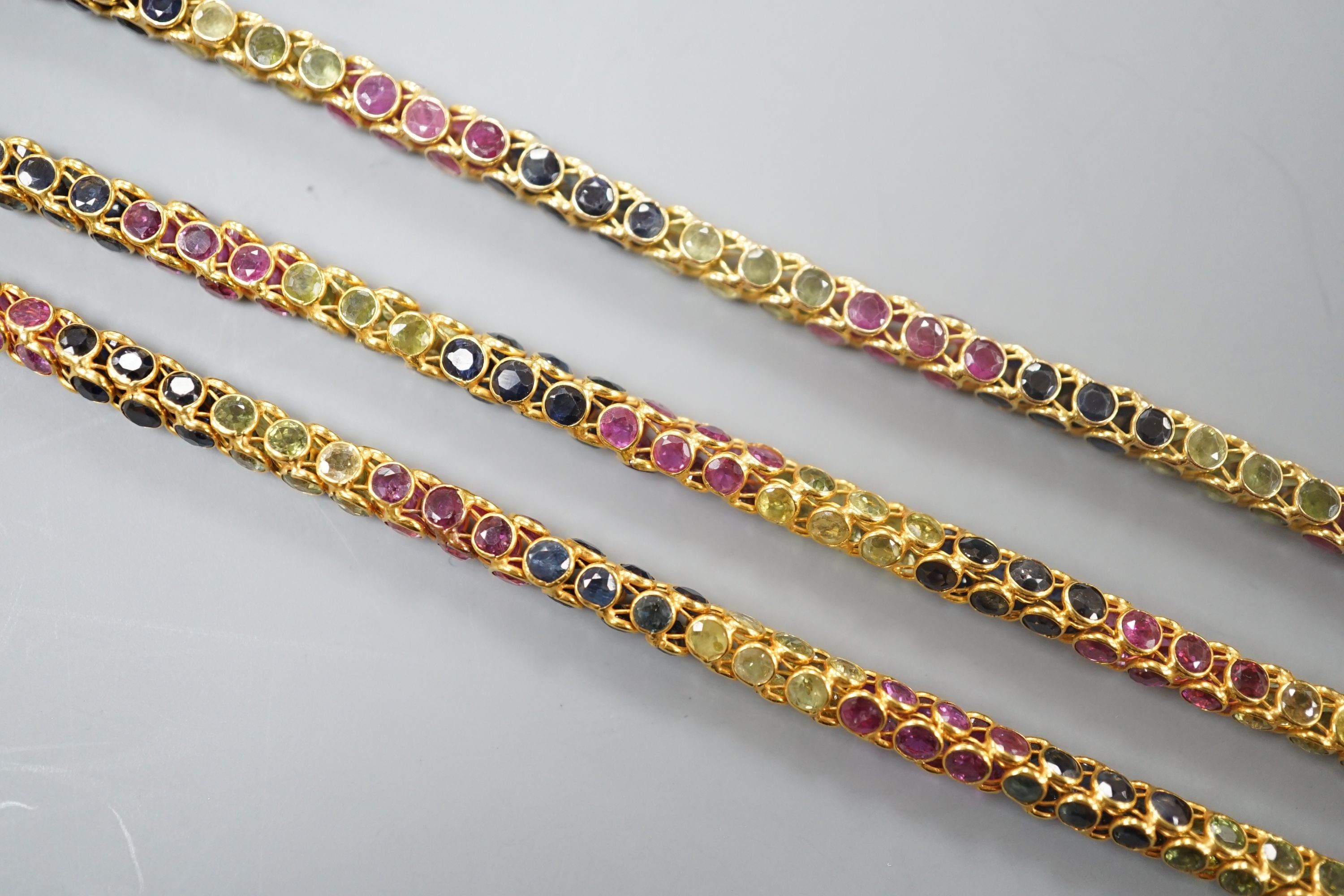 A modern Thai yellow metal and multi gem set necklace, 68cm and a similar bracelet stamped 585, 17.5cm, gross weight 35 grams.